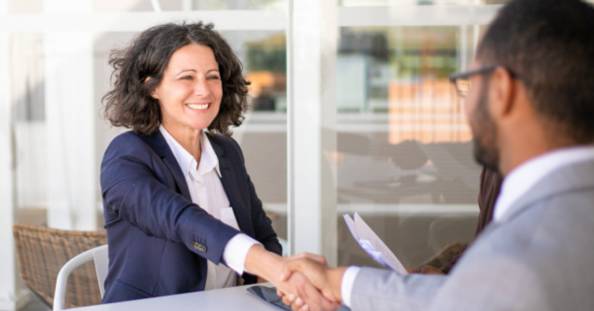 Attorney shaking hands with client