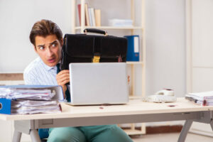 Businessman disgusted with cockroaches in the office